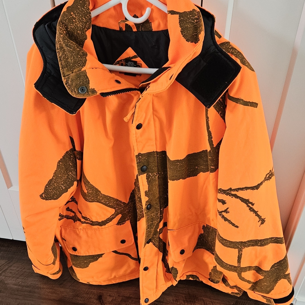 NEW, No Tags HFC Equipment Orange Camo  Coat w/full Zipper Plus Snaps. Size XL.
